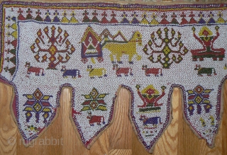 Beautiful old beaded toran from Gujarat, India. Nice old toran made of thousands and thousands of tiny beads strung together to make images of cows, flowers, bullock cart pulling shiva, etc. Satiny  ...