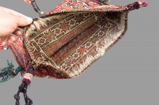 Antique Baluch double faced  bag with original long tassels.The  bag is in excellent condition with very slight even wear and good pile. 
Circa 1900       