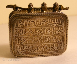 Koran Box with Inscription of Koranic Verses

A rare Koran box worn as a amulet pendant.
The inscription of Koranic verses are in TUGHRA form and are reposed .Box is provided with four delicate  ...