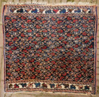 Afshar poshti? small rug, floral design,  75 x 75 cm. not quite square and some moths, signs of use, and the orange has softened, although the colours look good to me.  ...