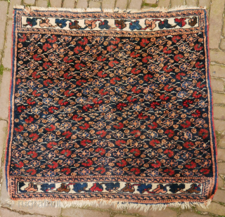 Afshar poshti? small rug, floral design, 75 x 75 cm. not quite square and some moths, signs of use, and the orange has softened, although the colours look good to me. Please  ...
