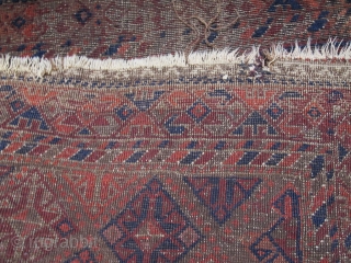 Square-shaped Baluch rug with a repeat diamond latch-hook design. All good color with a subtle but effective use of to tone. Thick patches of indigo dyed pile contrasting with corroded brown and  ...