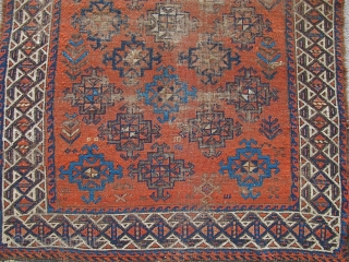 Baluch with stary field on an ochre ground. Looks like it should be symmetrically knotted but it is asymmetric open left. Beautiful spacing and placing of ornament. Traces of striped kilim on  ...