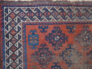 Baluch with stary field on an ochre ground. Looks like it should be symmetrically knotted but it is asymmetric open left. Beautiful spacing and placing of ornament. Traces of striped kilim on  ...