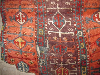 East Anatolian Kurdish Rug, Great Colors, especially the purple ground, Great Wool, blue wefted with traces of brocaded ends at the bottom. Great graphic quality. Very good age, fragmented and mounted. There  ...