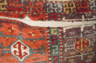 East Anatolian Kurdish Rug, Great Colors, especially the purple ground, Great Wool, blue wefted with traces of brocaded ends at the bottom. Great graphic quality. Very good age, fragmented and mounted. There  ...