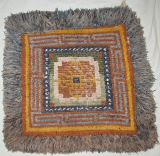 19th cen. Tibetan ' Wangden ' 'warp-back' square with Dorje Tantric thunderbolts making a quatrafoil in the center. Two greens. The pile portion measures about 27"x28". All good natural colors. Center is  ...