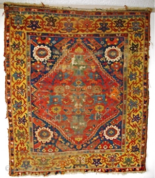 Kula type rug, (or at least it appears so at first glance) Intensely saturated colors including two yellows, at least three blues and four greens. Lots of lazy lines. The border is  ...