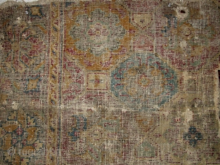 Indian Deccani carpet fragment. Circa 1700? Design reminiscent of Mughal pieces. corroded lac ground and black border with characteristic mustard gold. Very worn / blitzed with a white cotton foundation shinning forth.  ...