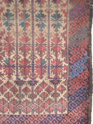 Camel-Ground Baluch rug . Perhaps Bahluli according to recent research. (see the current issue of Hali) Colorful latch-hook border (interestingly, there are no minor borders) and a great rendition of the classic  ...