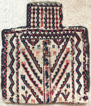 Baluch double-sided sumak salt bag with a design seemingly derived from a Turkmen tentband, one side more worn than the other, still very displayable and graphically powerful, squarish size 45x53cm   