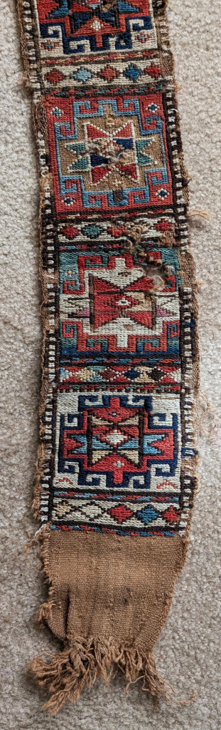 Inscribed Shahsevan sumak band with Memling guls and stars. Measures about 227x16cm including the macrame end finishes. The length of the sumak portion alone is 185cm. The colors are all good and  ...