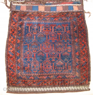 Complete Timuri type Baluch Khorjin Saddle Bag Set. The sides have been opened but the entire piece is complete and in great shape with both bagfaces, flat-woven fasteners and kilim bridge. Super  ...