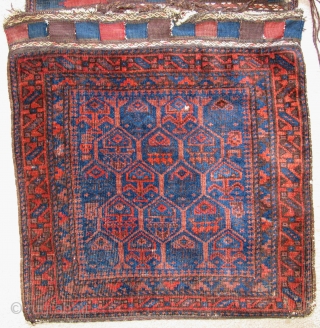 Complete Timuri type Baluch Khorjin Saddle Bag Set. The sides have been opened but the entire piece is complete and in great shape with both bagfaces, flat-woven fasteners and kilim bridge. Super  ...