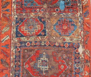 East Anatolian Kurdish Rug with  Memling Guls. Probably 18th century with a rich, diverse and moody color palette, exceptional wool and dramatic drawing. Worn and fragmented but gorgeous, mounted and conserved.  ...