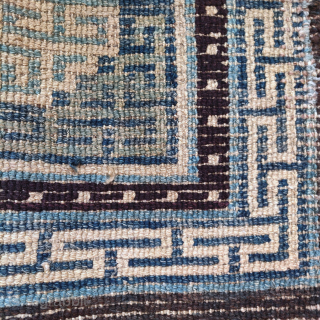 19th century Tibetan square, several indigo blues and intriguing integration of the corner-pieces with the central medallion, 61x56cm               