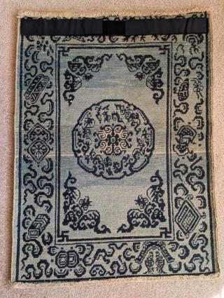 Small Tibetan rug with auspicious bats and cloudbands. Likely based in a Chinese textile design. Dramatic abrash, all natural dyes, great condition           