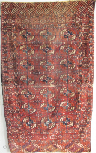 Tekke Long Rug, All colors are good, wool is soft and there are some silk highlights. Complete but with areas of wear and a stain at the very top. Older than most  ...