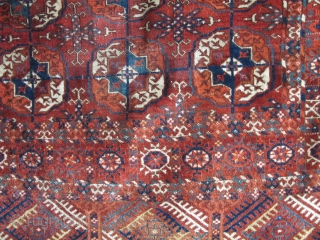 Tekke Long Rug, All colors are good, wool is soft and there are some silk highlights. Complete but with areas of wear and a stain at the very top. Older than most  ...