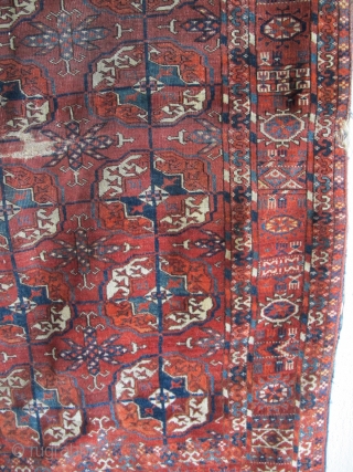 Tekke Long Rug, All colors are good, wool is soft and there are some silk highlights. Complete but with areas of wear and a stain at the very top. Older than most  ...