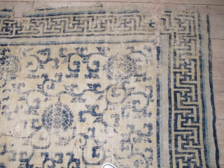 Classic Chinese Ningxia Carpet with vine-scroll and peonies field. Likely Kangxi period, large, smashed, with rips, tears, and several generations of repiling. Still majestic. About 8'x10'       