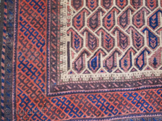 Very graphic camel ground Baluch rug with unusual geometric botehs arranged in a subtle but sophisticated repeat, creating diagonal negative space that works very well with the diagonal latch-hook striped border. The  ...