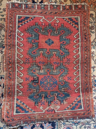 Konya yastik with a variant of a Holbein gul, front and back images. Condition is a little rough with some kashmiring of the oxidized dark brown as can be seen on the  ...