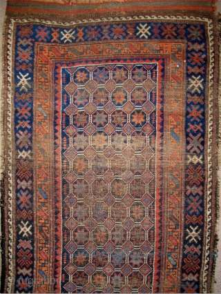 Baluch Runner, great natural colors, woven like a giant long bagface with a repeat mosaic like pattern of eight-pointed stars in a lattice. "Arab" type, open right, with corroded deep indigo almost  ...