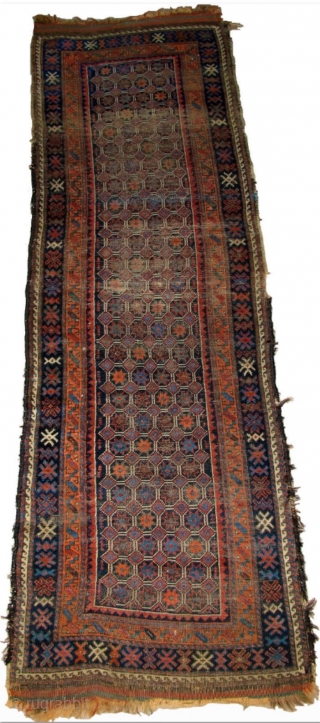 Baluch Runner, great natural colors, woven like a giant long bagface with a repeat mosaic like pattern of eight-pointed stars in a lattice. "Arab" type, open right, with corroded deep indigo almost  ...