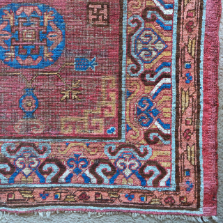 Khotan rug, smaller size measuring 3'6"x5'7". Classic central medallion design with a fantastic border. Areas of conservative restoration.               