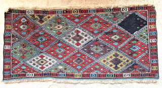 Flatwoven mafrash side panel, vivid natural color, deep aubergine, green, gold, peach and madder-red, cotton white. Some old reweave can be seen in the back image. One diamond.