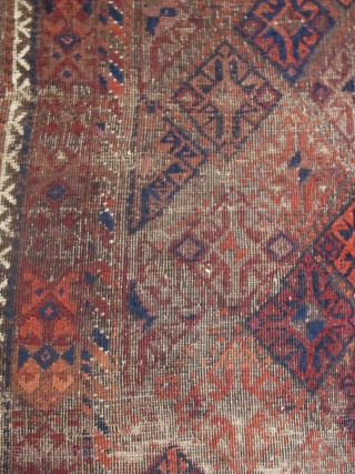 Square-shaped Baluch rug with a repeat diamond latch-hook design. All good color with a subtle but effective use of to tone. Thick patches of indigo dyed pile contrasting with corroded brown and  ...