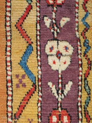 Vivid Saturated Color. Two matching fragments of an Anatolian Yatak, mounted together and conserved. multicolored carnations on a golden-saffron abrashed ground, perfect aubergine among the rainbow of colors.     