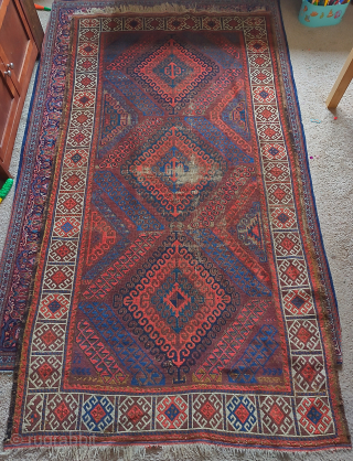 Symmetrically knotted Baluch rug with a Mushwani type diamond design. Some wear and old attempts at restoration. Dynamic and fun with nice natural color. 3'8"x6'10"        