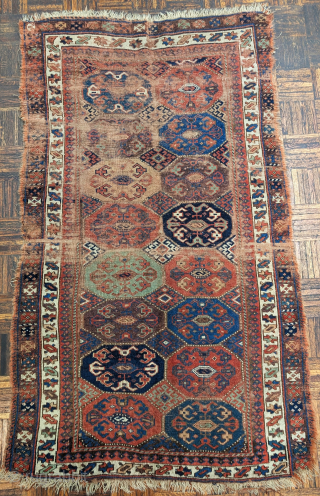 Northwest Persian Kurdish rug with an unusual octagon and diamond field design.Very nice color including two greens and aubergine. Worn but still beautiful and mostly readable. Bottom outer guard border missing. 3'7"x6'2" 