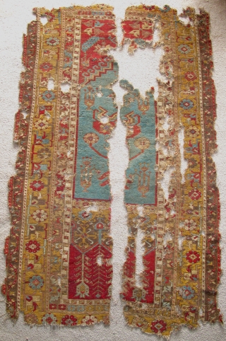 Ladik Prayer Rug, late 18th century, severely fragmented in two sections, dynamic drawing with many stylized ewers, very dirty and damaged but with a vibrant and uncommon gold border, recently found in  ...