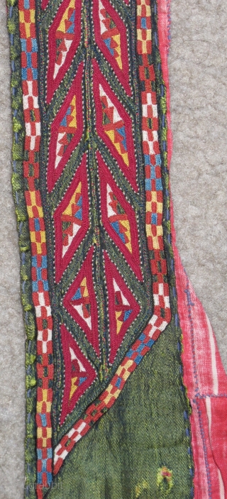 Tekke Turkmen embroidered band. Very fine. Very colorful with several blues, yellow, orange and insect red. Embroidered on a hand-woven green silk. 105x6cm          