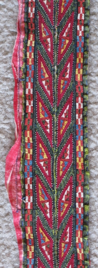 Tekke Turkmen embroidered band. Very fine. Very colorful with several blues, yellow, orange and insect red. Embroidered on a hand-woven green silk. 105x6cm          