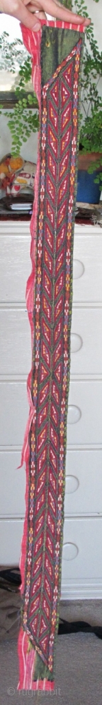 Tekke Turkmen embroidered band. Very fine. Very colorful with several blues, yellow, orange and insect red. Embroidered on a hand-woven green silk. 105x6cm          