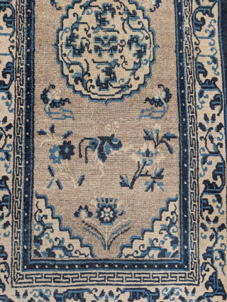 Antique Tibetan rug with a speckled natural oatmeal-colored ground. The format and drawing are based on Ningxia rugs of the 19th century. Very pleasing piece. 2'6"x5'4"
       