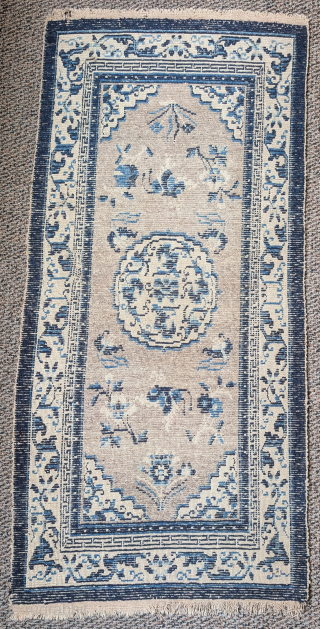 Antique Tibetan rug with a speckled natural oatmeal-colored ground. The format and drawing are based on Ningxia rugs of the 19th century. Very pleasing piece. 2'6"x5'4"
       