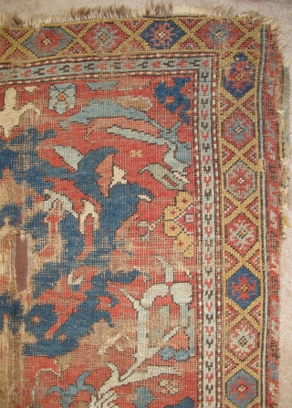 Smyrna small format carpet, probably 18th century, obvious damage, mounted on brown textile. Big knots, depressed warp, subtle color with two yellows and several blue-greens. (size is 6'3"x4'1")     