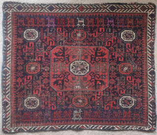 Baluch octagon star bag face with animal trains and copious silk highlights. 28"x24"
This piece has a great presence and displays well. Some coroded brown wool looks like it had been painted to  ...