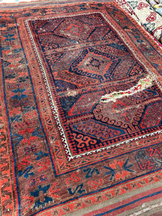 Smaller Baluch main carpet with a "Mushwani" design. Good age and patina, rip in field, fantastic color, paired animals, a nice older example from Western Afghanistan