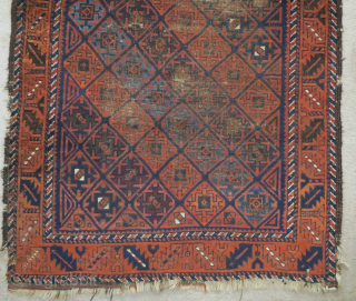 Baluch rug with serrated ashik-like tile design and a leaf border. Several blues, nice color in general. Goat hair side selvedge. 3'6"x6'3"
 
          