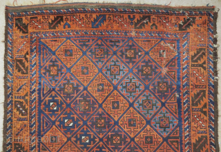 Baluch rug with serrated ashik-like tile design and a leaf border. Several blues, nice color in general. Goat hair side selvedge. 3'6"x6'3"
 
          
