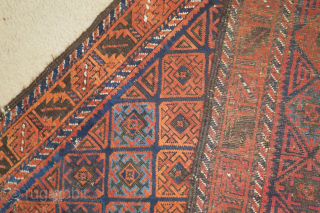 Baluch rug with serrated ashik-like tile design and a leaf border. Several blues, nice color in general. Goat hair side selvedge. 3'6"x6'3"
 
          