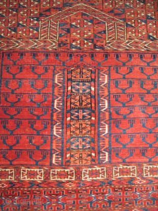 Tekke Ensi, some silk highlights, interesting sainak formation, area of repair in bottom left border. Flashy color including a light blue and insect red. Velvety pile.       