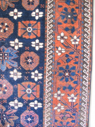 Khorossan Baluch Minakhani Rug with Open Blossoms. This is an uncommon variant seen most frequently on earlier minakhani Baluch carpets. This piece was woven with depressed warps, natural colors including aubergine and  ...