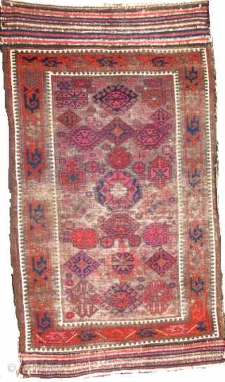 Khorosan Baluch rug, with corroded brown ground and design elements often associated with Timuri type weavings. Very intriguing central element. Lots of cochineal and madder.        